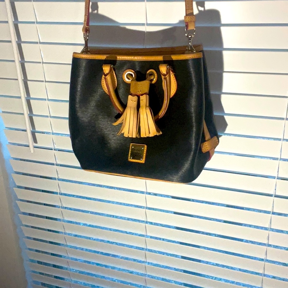 Authentic Dooney & Bourke, black with red interior. Clean and cute.